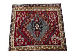 Surface texture of 2000s Shiraz rug with natural Wool and intricate pattern