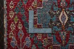 Backside of handmade 2000s Shiraz rug showing knot structure and weave density