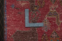 Backside of handmade 2000s Shiraz rug showing knot structure and weave density