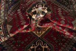 Corner detail of 2000s Shiraz rug showing border pattern and Wool pile
