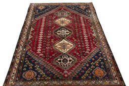 Surface texture of 2000s Shiraz rug with natural Wool and intricate pattern