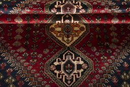 Full view of 2000s Shiraz rug from Iran / Persia, 271 × 173 cm in Red tones