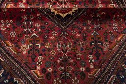 Corner detail of 2000s Shiraz rug showing border pattern and Wool pile