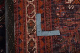 Surface texture of 2000s Shiraz rug with natural Wool and intricate pattern