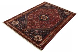 Corner detail of 2000s Shiraz rug showing border pattern and Wool pile