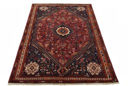 Surface texture of 2000s Shiraz rug with natural Wool and intricate pattern