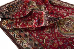 Corner detail of 2000s Shiraz rug showing border pattern and Cotton pile