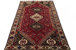 Surface texture of 2000s Shiraz rug with natural Wool and intricate pattern