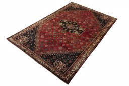 Corner detail of 2000s Shiraz rug showing border pattern and Wool pile