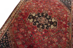 Backside of handmade 2000s Shiraz rug showing knot structure and weave density