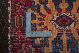 Backside of handmade 2000s Shiraz rug showing knot structure and weave density