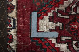 Backside of handmade 2000s Shiraz rug showing knot structure and weave density