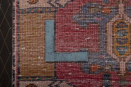 Backside of handmade 2000s Shiraz rug showing knot structure and weave density