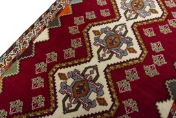 Backside of handmade 2000s Shiraz rug showing knot structure and weave density
