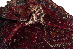 Corner detail of 2000s Shiraz rug showing border pattern and Wool pile