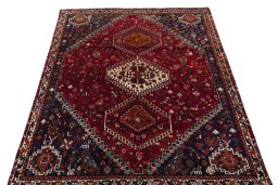 Surface texture of 2000s Shiraz rug with natural Wool and intricate pattern