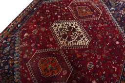Backside of handmade 2000s Shiraz rug showing knot structure and weave density