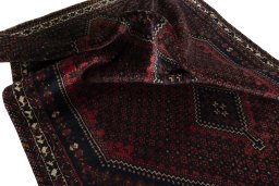 Corner detail of 2000s Shiraz rug showing border pattern and Cotton pile