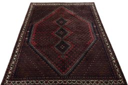 Surface texture of 2000s Shiraz rug with natural Cotton and intricate pattern