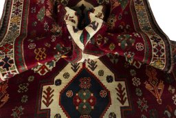 Corner detail of 2000s Shiraz rug showing border pattern and Wool pile