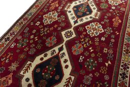 Backside of handmade 2000s Shiraz rug showing knot structure and weave density
