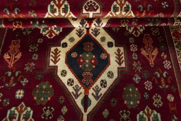 Full view of 2000s Shiraz rug from Iran / Persia, 277 × 167 cm in Red tones