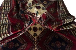 Corner detail of 2000s Shiraz rug showing border pattern and Wool pile