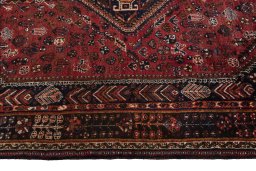 Full view of 1970s Shiraz rug from Iran / Persia, 284 × 173 cm in Red tones