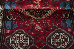 Corner detail of 2000s Shiraz rug showing border pattern and Wool pile