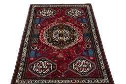 Surface texture of 2000s Shiraz rug with natural Wool and intricate pattern
