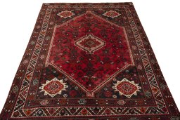Surface texture of 2000s Shiraz rug with natural Wool and intricate pattern