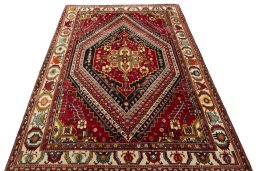 Surface texture of 2000s Shiraz rug with natural Wool and intricate pattern