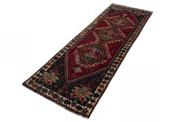 Corner detail of 2000s Shiraz rug showing border pattern and Wool pile