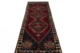 Surface texture of 2000s Shiraz rug with natural Wool and intricate pattern