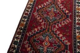 Backside of handmade 2000s Shiraz rug showing knot structure and weave density