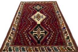 Surface texture of 2000s Shiraz rug with natural Wool and intricate pattern