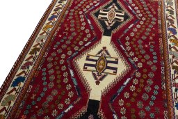 Backside of handmade 2000s Shiraz rug showing knot structure and weave density