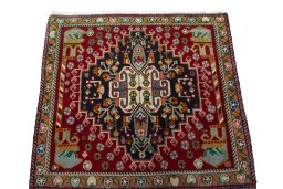 Surface texture of 2000s Shiraz rug with natural Wool and intricate pattern