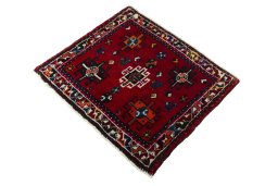 Corner detail of 2000s Shiraz rug showing border pattern and Wool pile