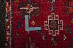 Backside of handmade 2000s Shiraz rug showing knot structure and weave density