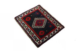 Corner detail of 2000s Shiraz rug showing border pattern and Wool pile