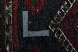 Backside of handmade 2000s Shiraz rug showing knot structure and weave density