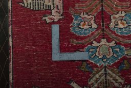 Backside of handmade 2000s Shiraz rug showing knot structure and weave density