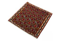 Corner detail of 2000s Shiraz rug showing border pattern and Wool pile