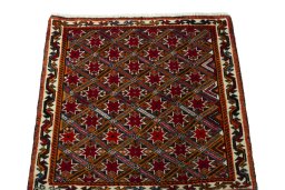 Surface texture of 2000s Shiraz rug with natural Wool and intricate pattern