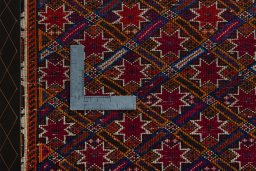 Backside of handmade 2000s Shiraz rug showing knot structure and weave density
