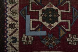 Backside of handmade 2000s Shiraz rug showing knot structure and weave density