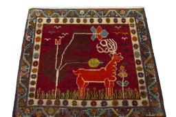 Surface texture of 2000s Shiraz rug with natural Wool and intricate pattern