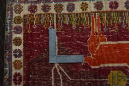 Backside of handmade 2000s Shiraz rug showing knot structure and weave density