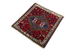 Corner detail of 2000s Shiraz rug showing border pattern and Wool pile
